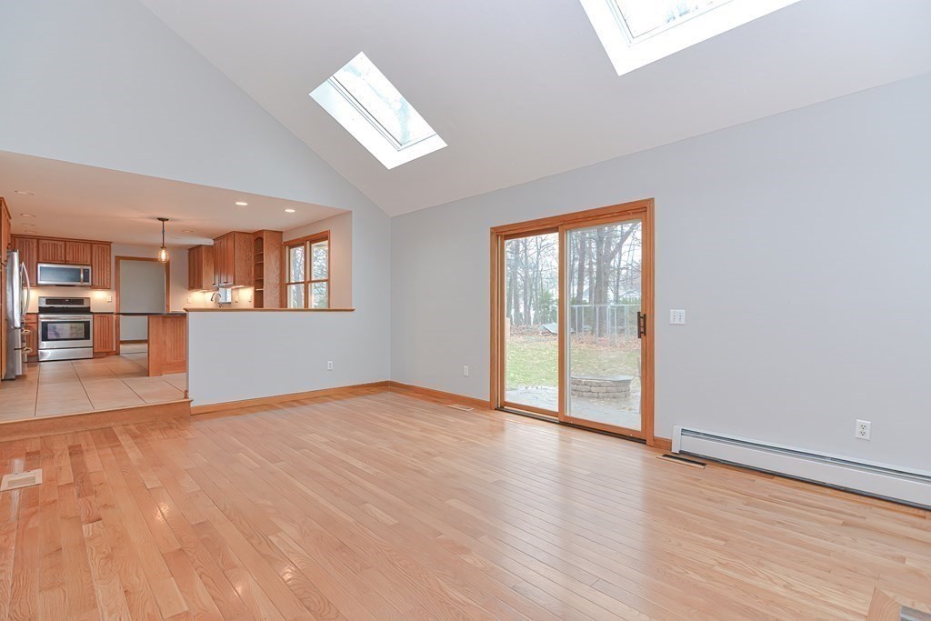 4 Bugli Lane Wakefield, MA 01880 - Photo 12 of 32 wooden floor in an empty room with a window