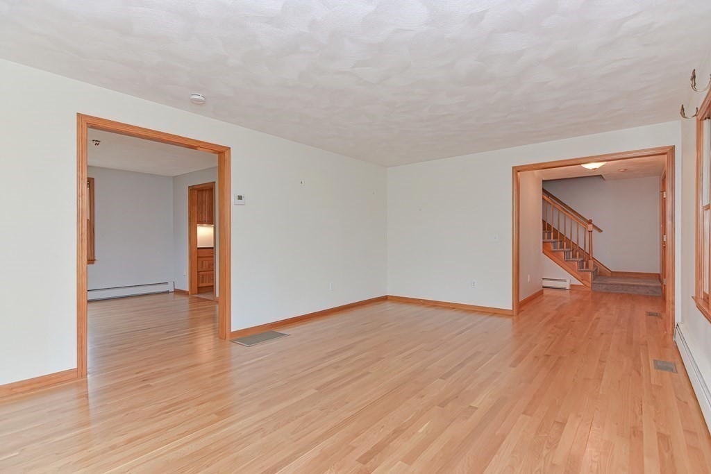 4 Bugli Lane Wakefield, MA 01880 - Photo 15 of 32 a view of empty room with wooden floor