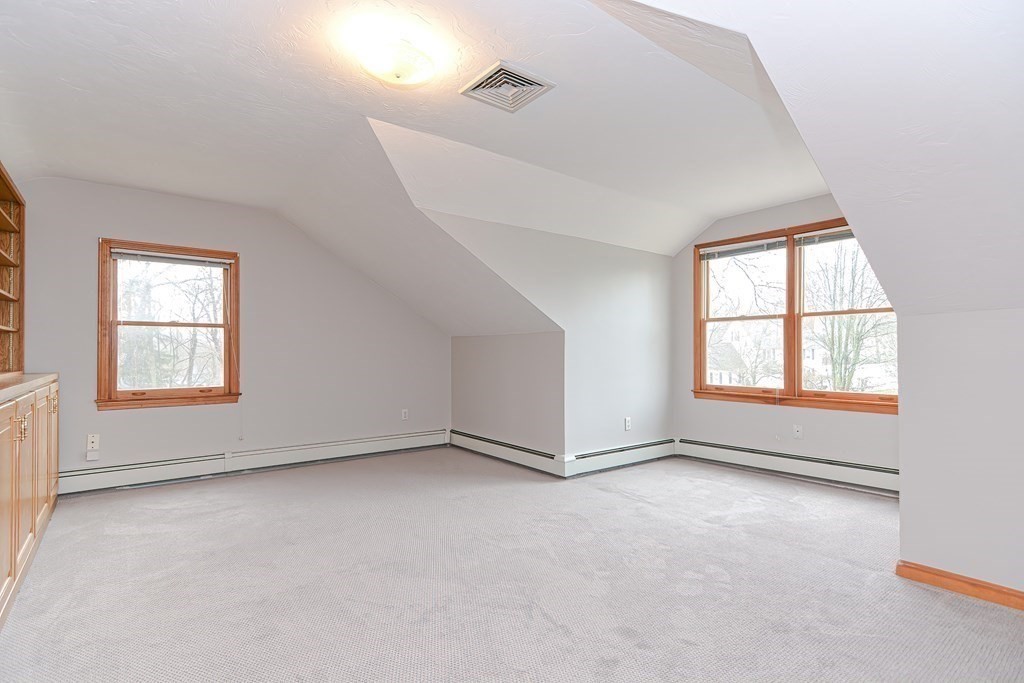 4 Bugli Lane Wakefield, MA 01880 - Photo 23 of 32 an empty room with windows