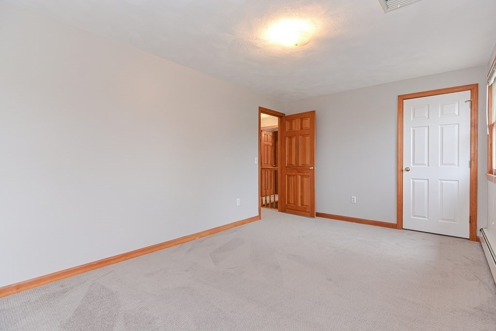 4 Bugli Lane Wakefield, MA 01880 - Photo 26 of 32 a view of an empty room and a window