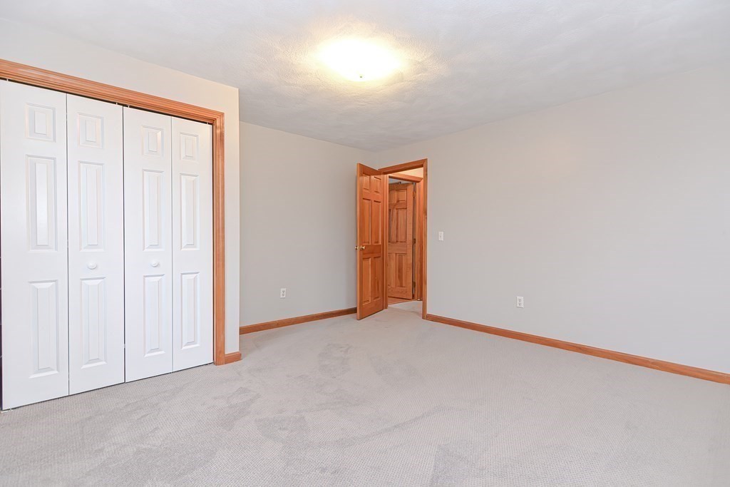 4 Bugli Lane Wakefield, MA 01880 - Photo 29 of 32 an empty room with an entryway