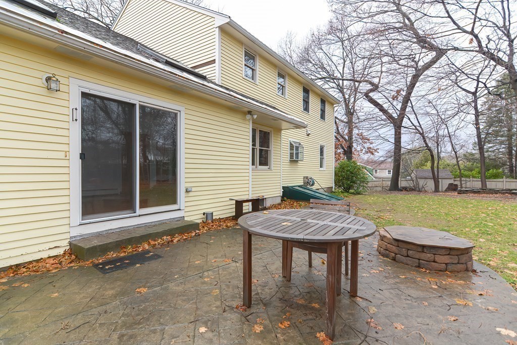 4 Bugli Lane Wakefield, MA 01880 - Photo 31 of 32 a view of a house with backyard and sitting area