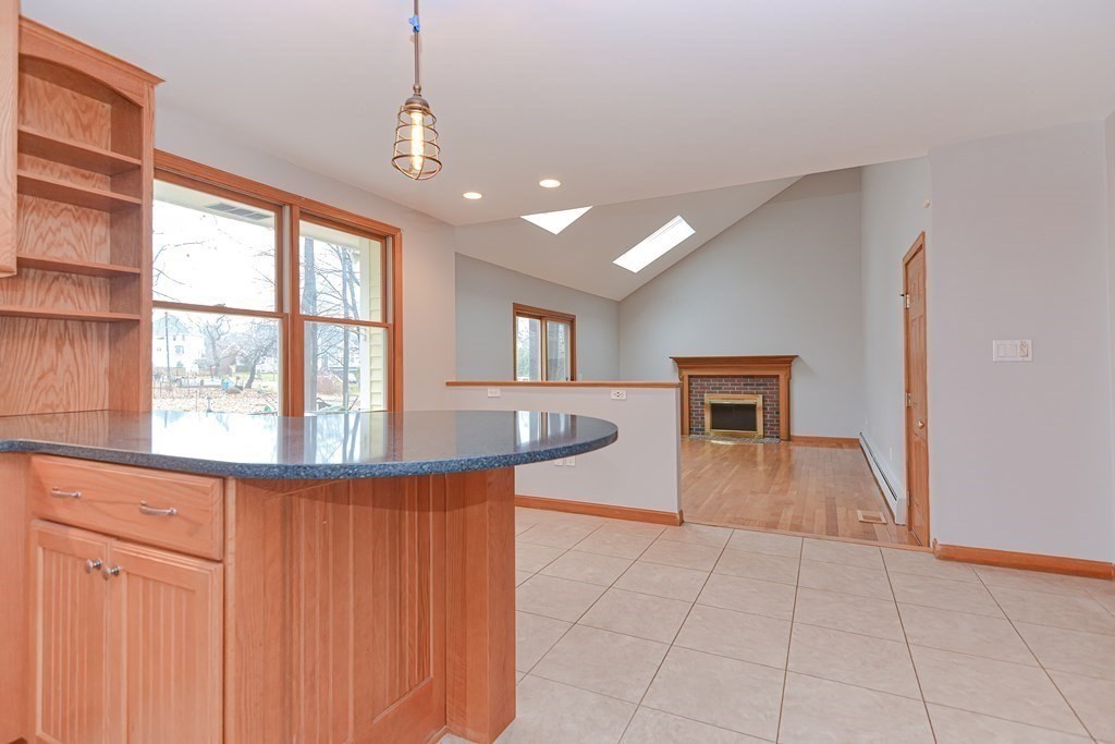 4 Bugli Lane Wakefield, MA 01880 - Photo 10 of 32 a view of a room with a window and wooden floor
