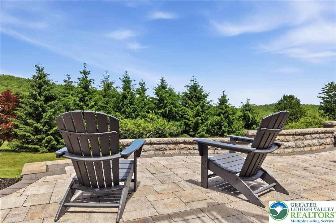 115 West Butternut Road Hellertown, PA 18055 - Photo 76 of 97 A spacious stone patio offers a secluded outdoor retreat with scenic views.