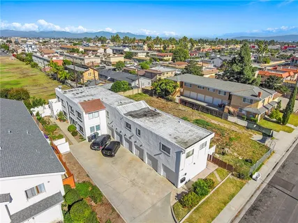 an aerial view of a house with a swimming pool