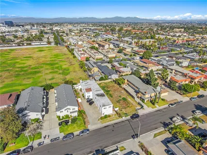 an aerial view of residential houses with outdoor space