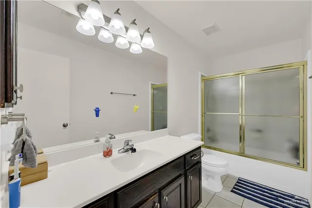 a living room with furniture a dining table and chairs