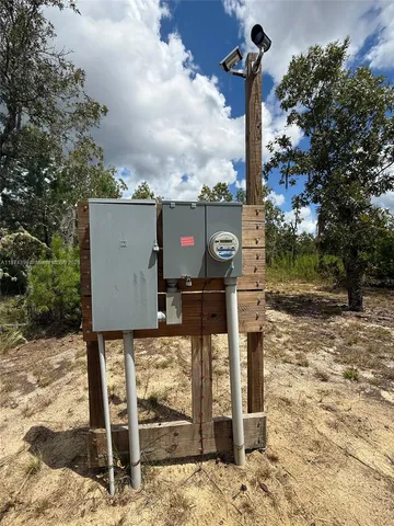 a sign board with building in the background