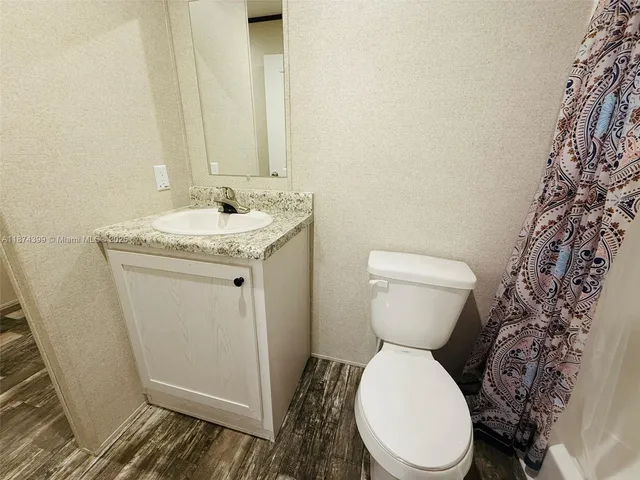a bathroom with a toilet and a sink
