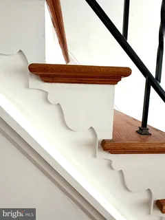a view of staircase with white walls