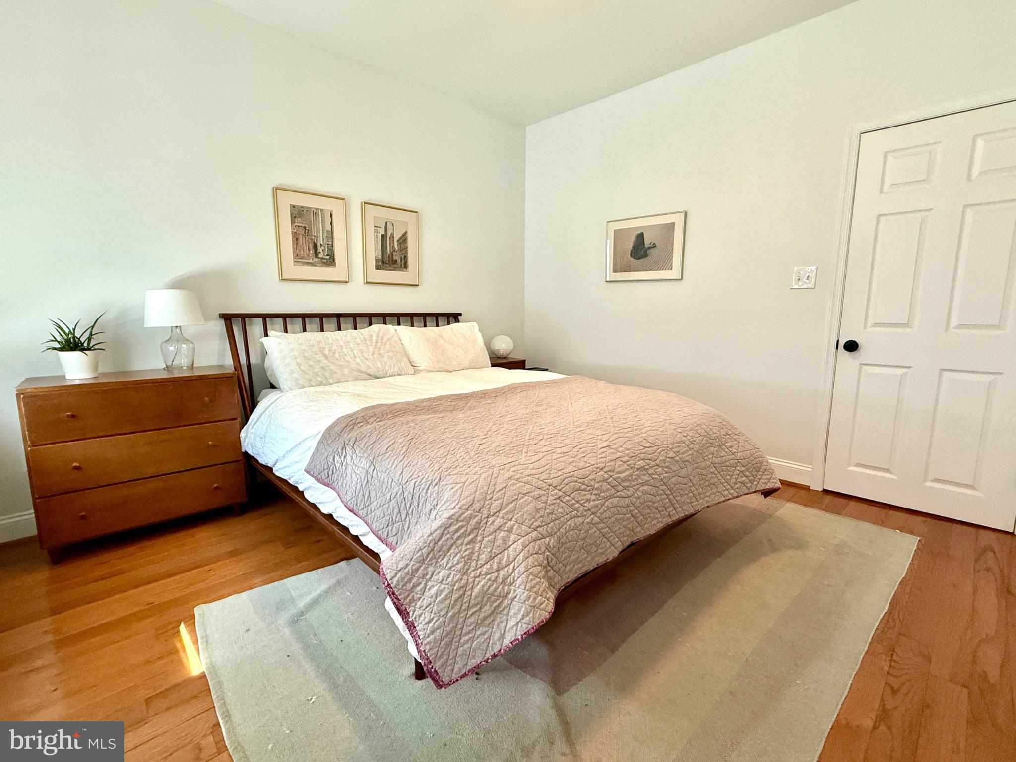 1509 Emily Street Philadelphia, PA 19145 - Photo 15 of 33 a bedroom with a bed and a night stand
