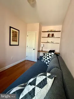 a bedroom with a bed and a cabinet