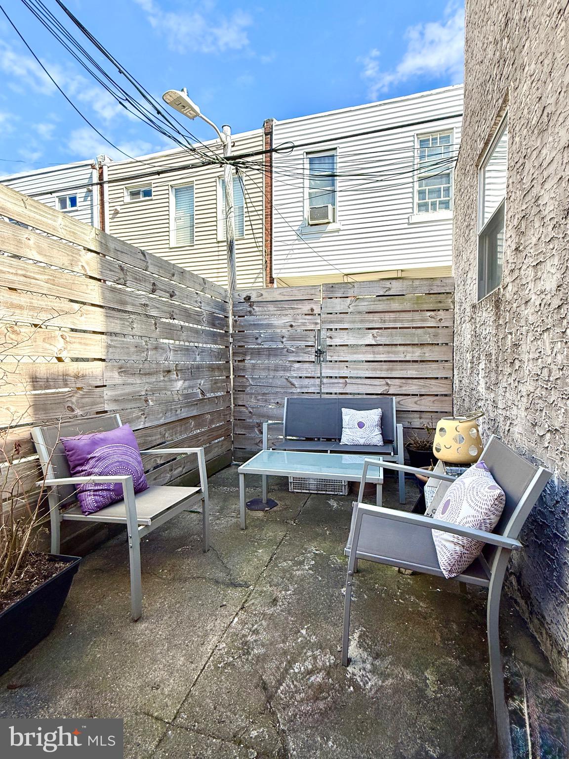 1509 Emily Street Philadelphia, PA 19145 - Photo 29 of 33 a backyard of a house with outdoor seating