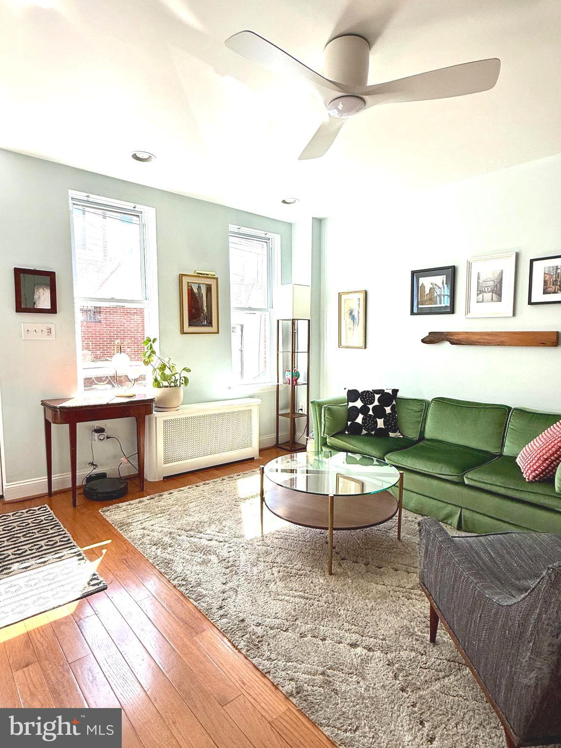 1509 Emily Street Philadelphia, PA 19145 - Photo 4 of 33 a living room with furniture and a wooden floor