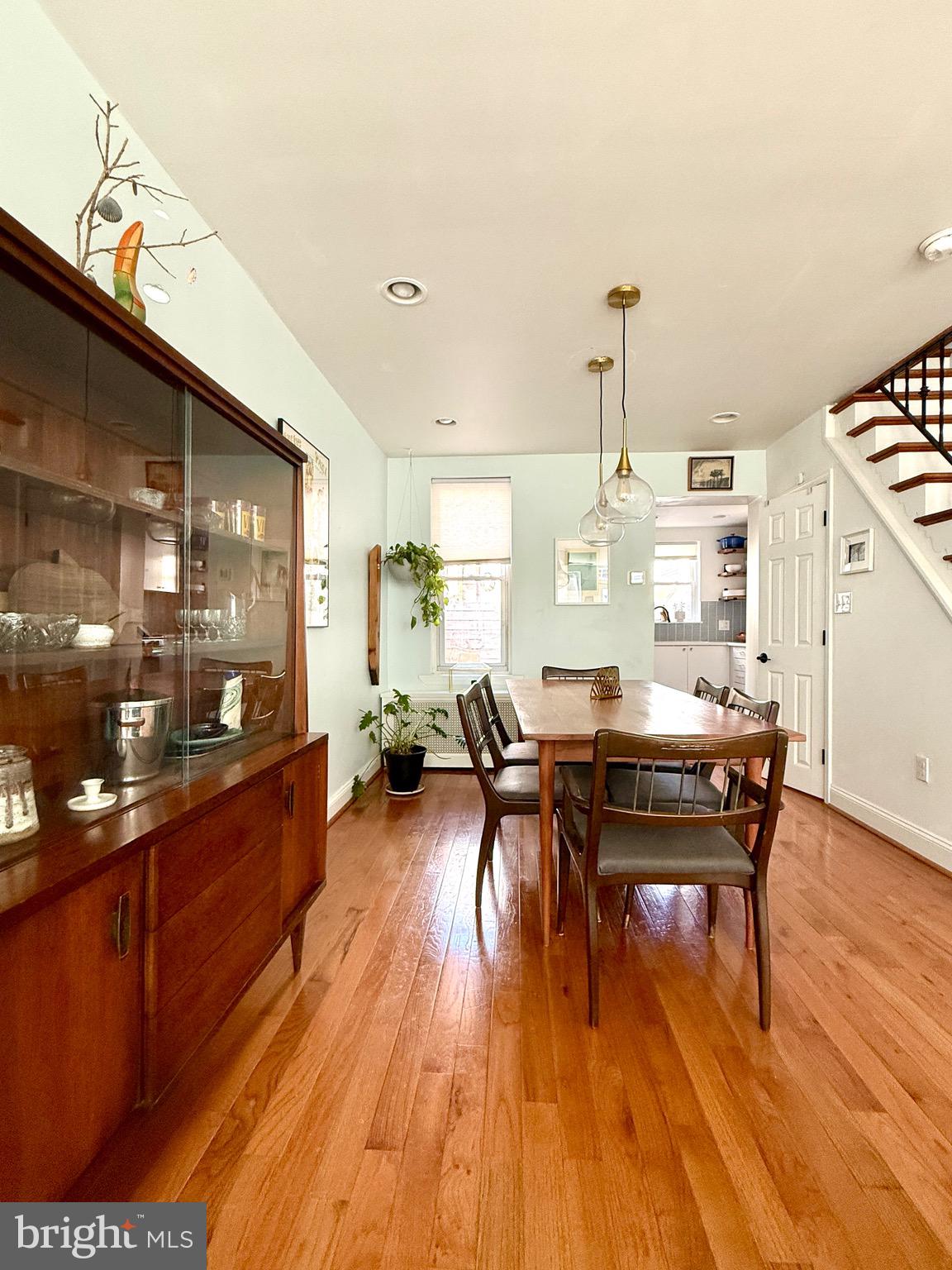 1509 Emily Street Philadelphia, PA 19145 - Photo 8 of 33 a living room with furniture a dining table and wooden floor
