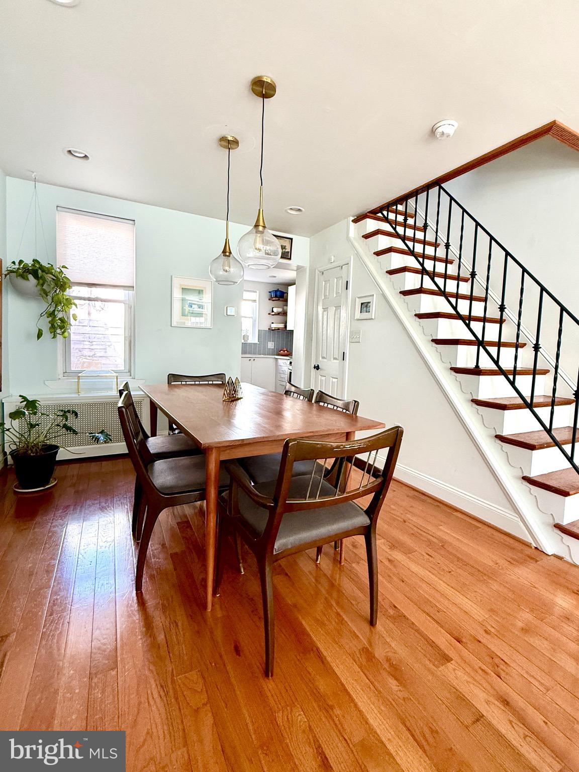 1509 Emily Street Philadelphia, PA 19145 - Photo 9 of 33 a dining room with furniture a chandelier and wooden floor