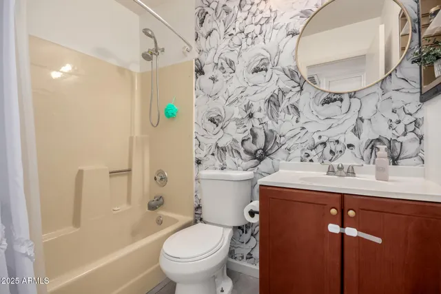 a view of an entryway with a flower pot and a living room