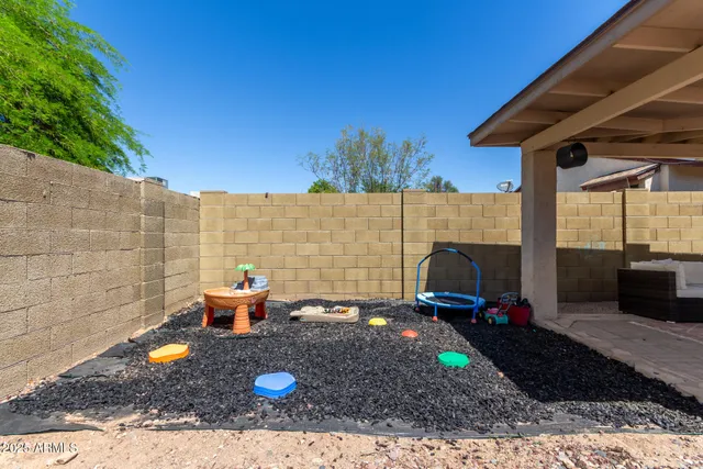 a view of a backyard with sitting area and furniture