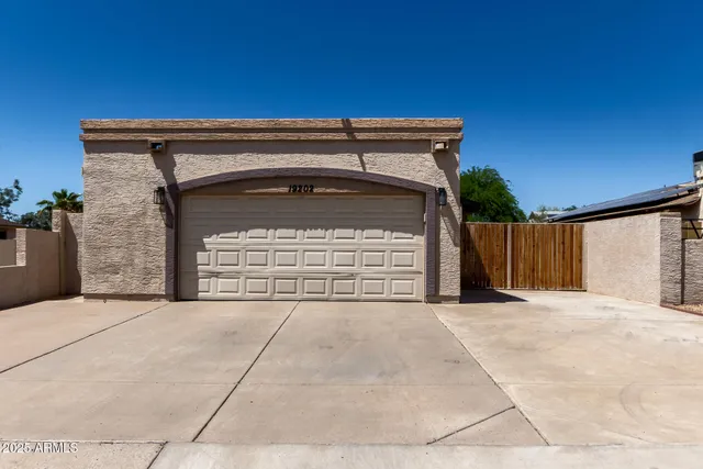 a front view of a house with a garage