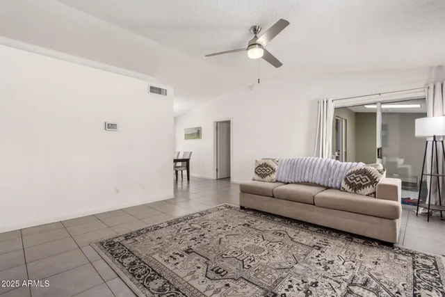 a living room with furniture and a rug