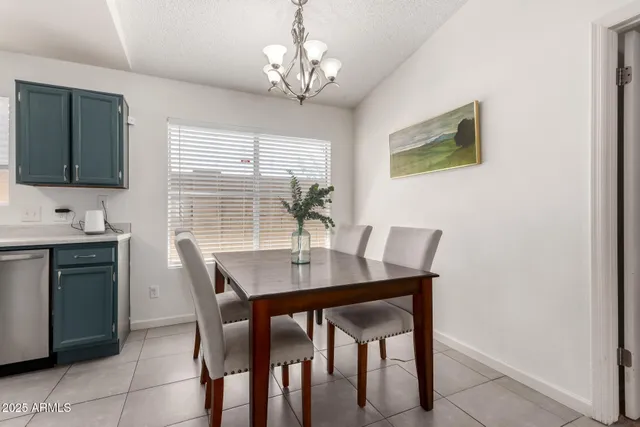 a view of a dining room with furniture and window