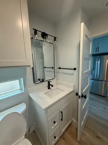 a bathroom with a sink toilet and shower