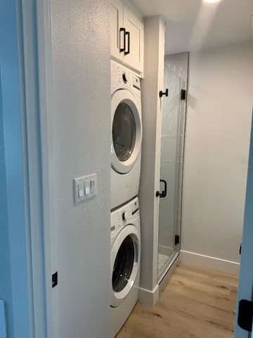 a view of a hallway with washer and dryer