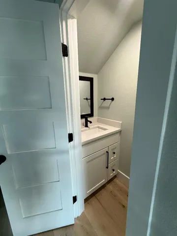 a bathroom with a sink and mirror