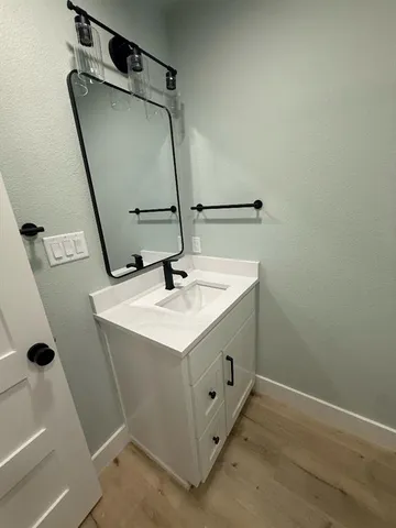 a bathroom with a sink and mirror