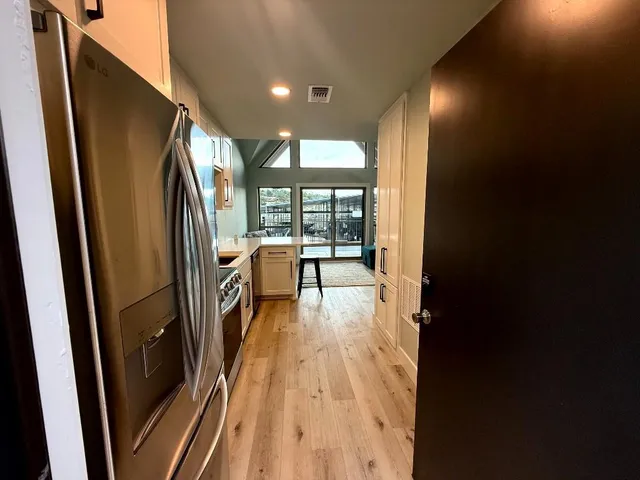 a view of a kitchen with a refrigerator
