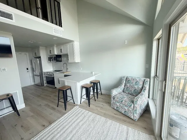 a living room with furniture and a table