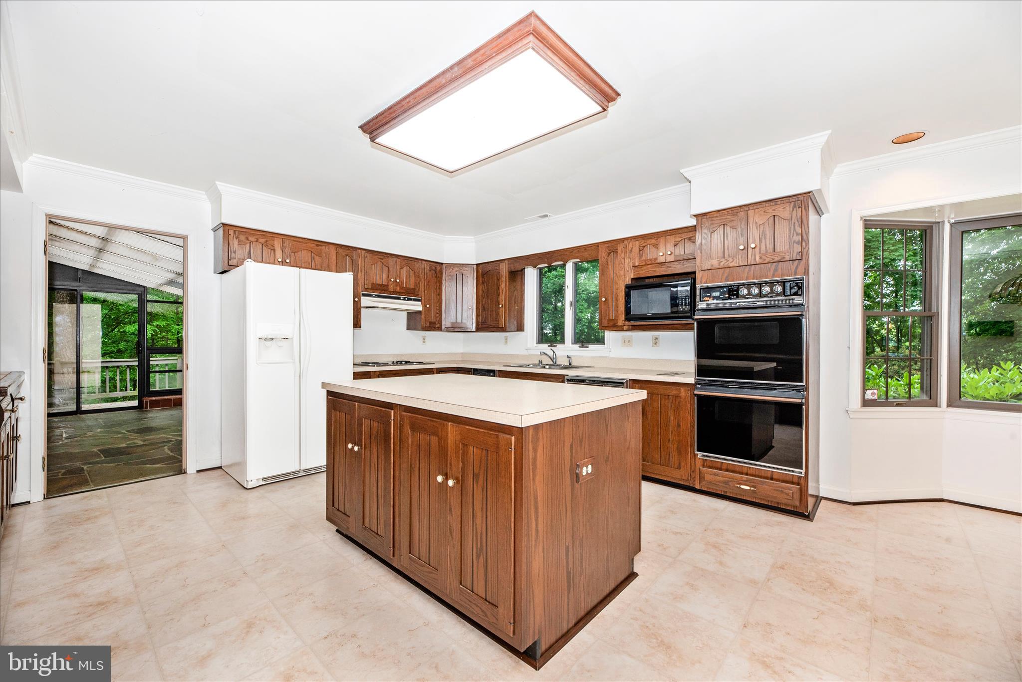 2221 Gold Mine Road Brookeville, MD 20833 - Photo 16 of 60 a kitchen with stainless steel appliances granite countertop a stove and a refrigerator