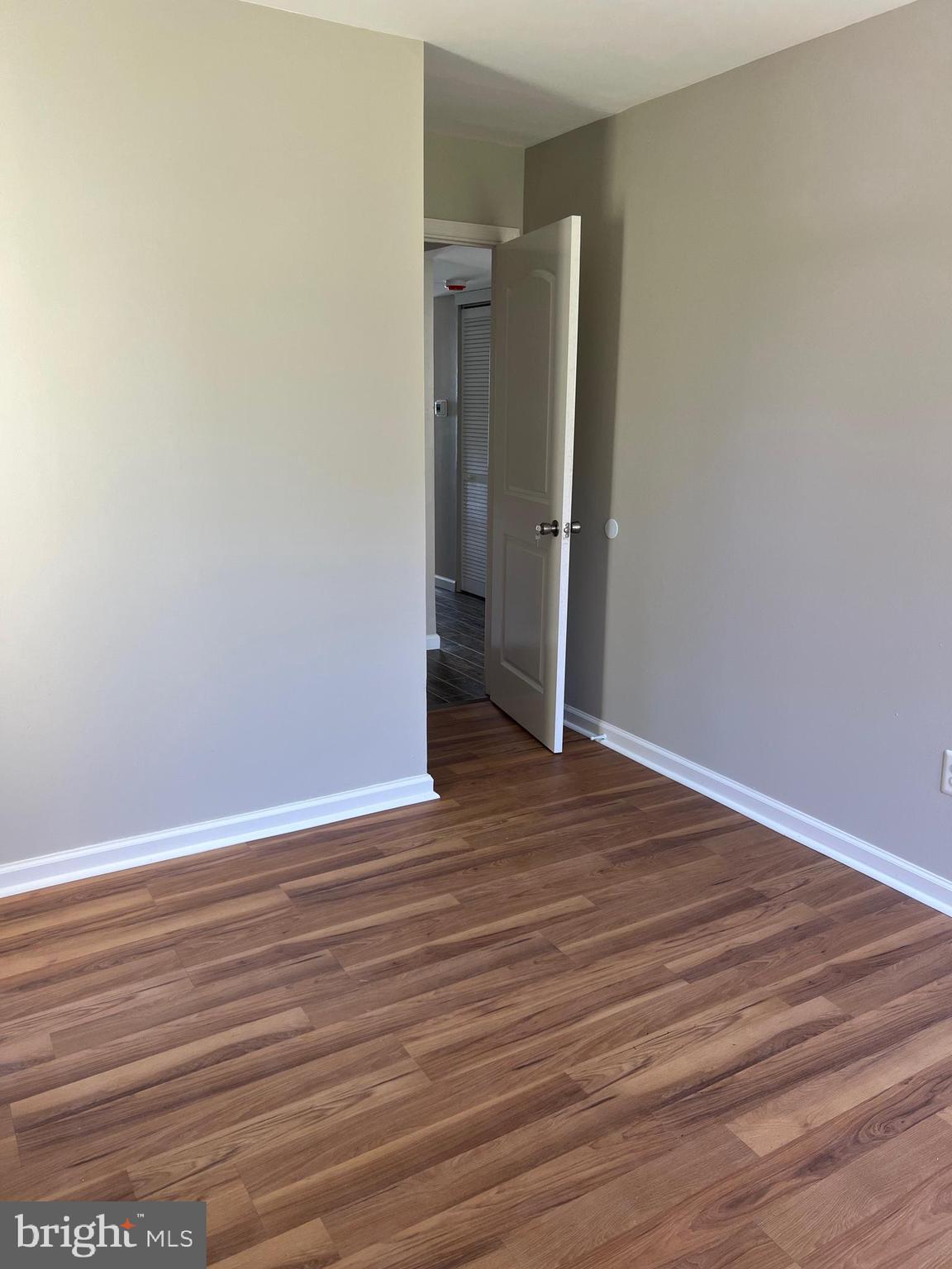 16 Maynard Drive, Unit A Sicklerville, NJ 08081 - Photo 12 of 17 a view of an empty room with wooden floor and closet
