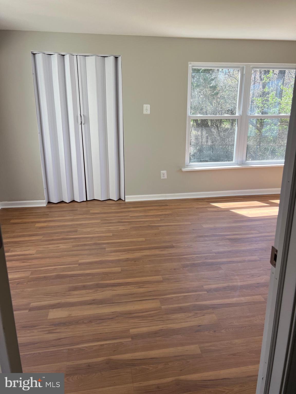 16 Maynard Drive, Unit A Sicklerville, NJ 08081 - Photo 14 of 17 a view of a room with wooden floor and window