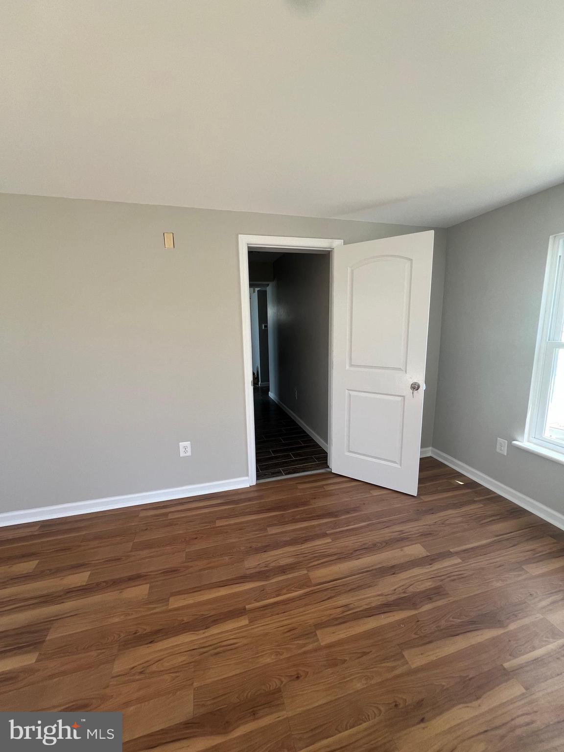 16 Maynard Drive, Unit A Sicklerville, NJ 08081 - Photo 17 of 17 a view of an empty room with wooden floor