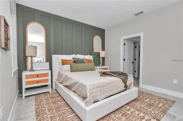 a bedroom with bed and a window