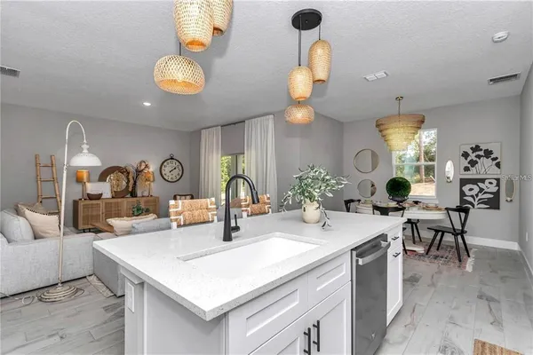 a view of a dining room and kitchen