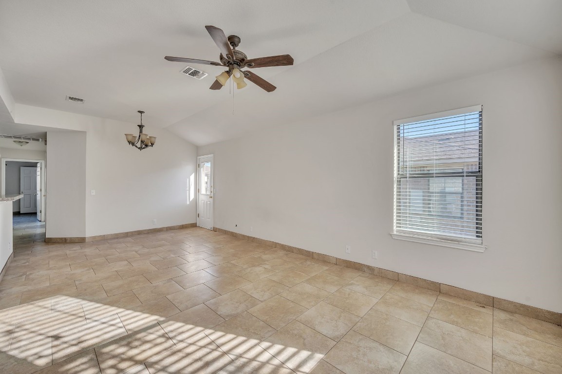 1007 Trail Driver Cove Georgetown, TX 78626 - Photo 12 of 16 a view of a livingroom with a ceiling fan and window