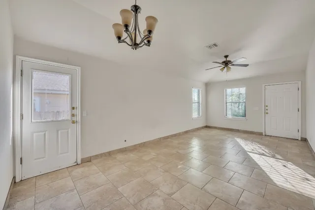 a view of an empty room with a window