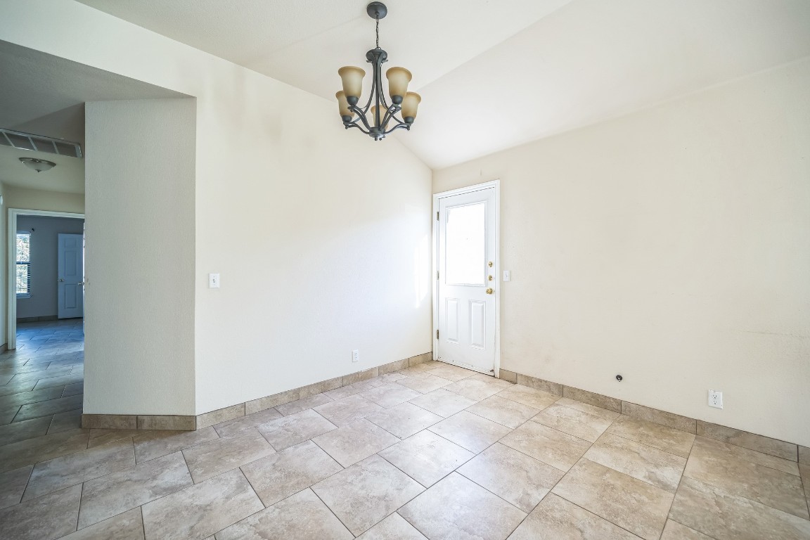 1007 Trail Driver Cove Georgetown, TX 78626 - Photo 14 of 16 a view of a hallway with a chandelier fan