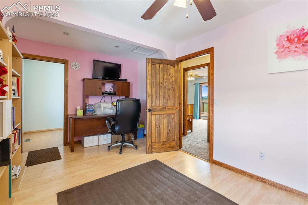 18895 Sage Crest Road Peyton, CO 80831 - Photo 16 of 38 a view of a workspace with furniture and a window