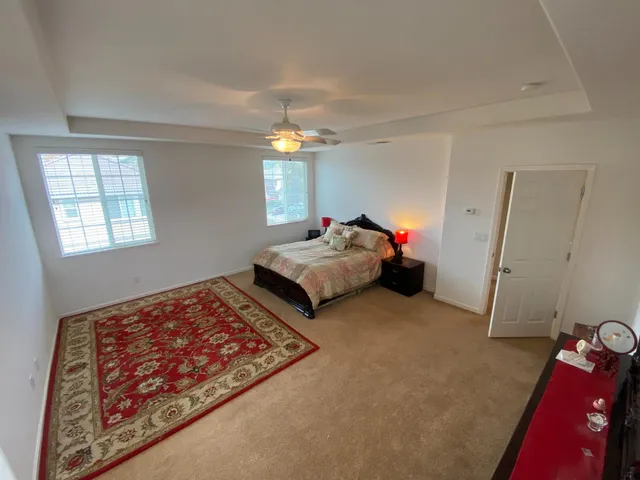 a bedroom with bed and window