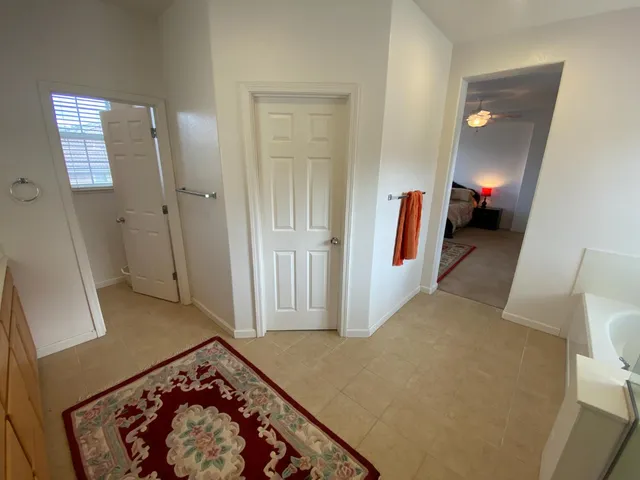 a bathroom with a toilet a sink and a window
