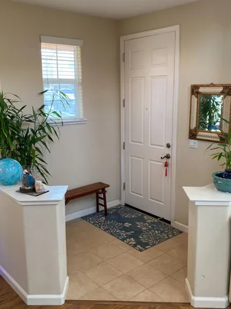 a view of a livingroom with furniture and a window