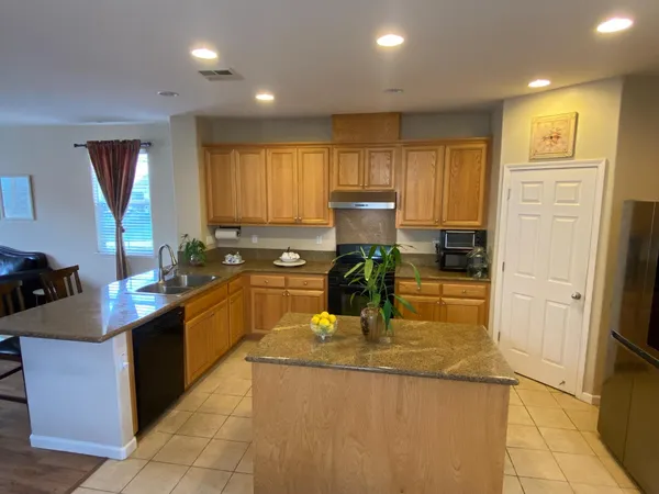a kitchen with counter top space cabinets and stainless steel appliances