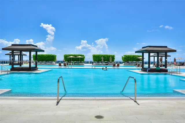 a view of a swimming pool with a patio