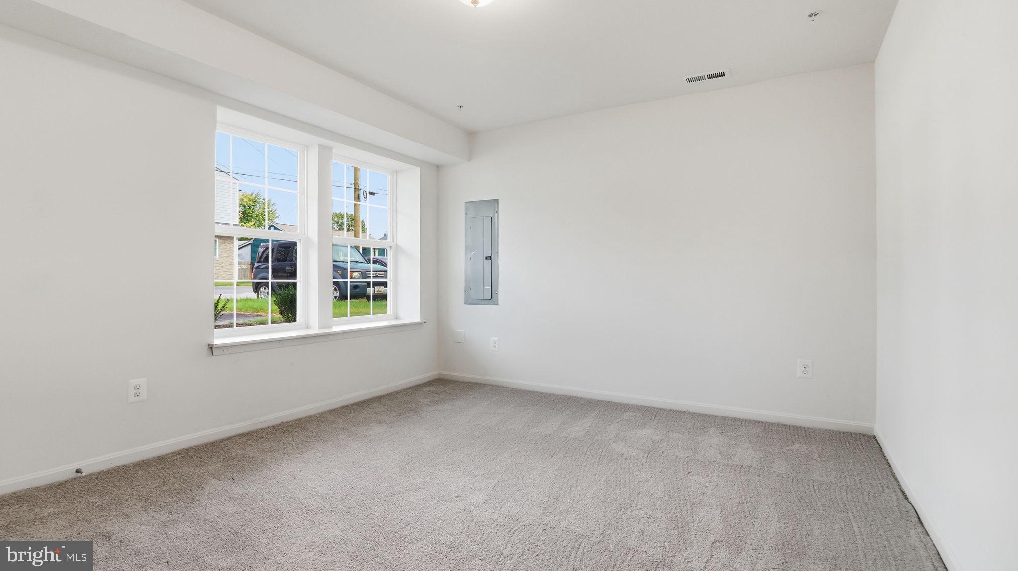 7349 Hughes Avenue Sparrows Point, MD 21219 - Photo 13 of 38 a view of an empty room with a window