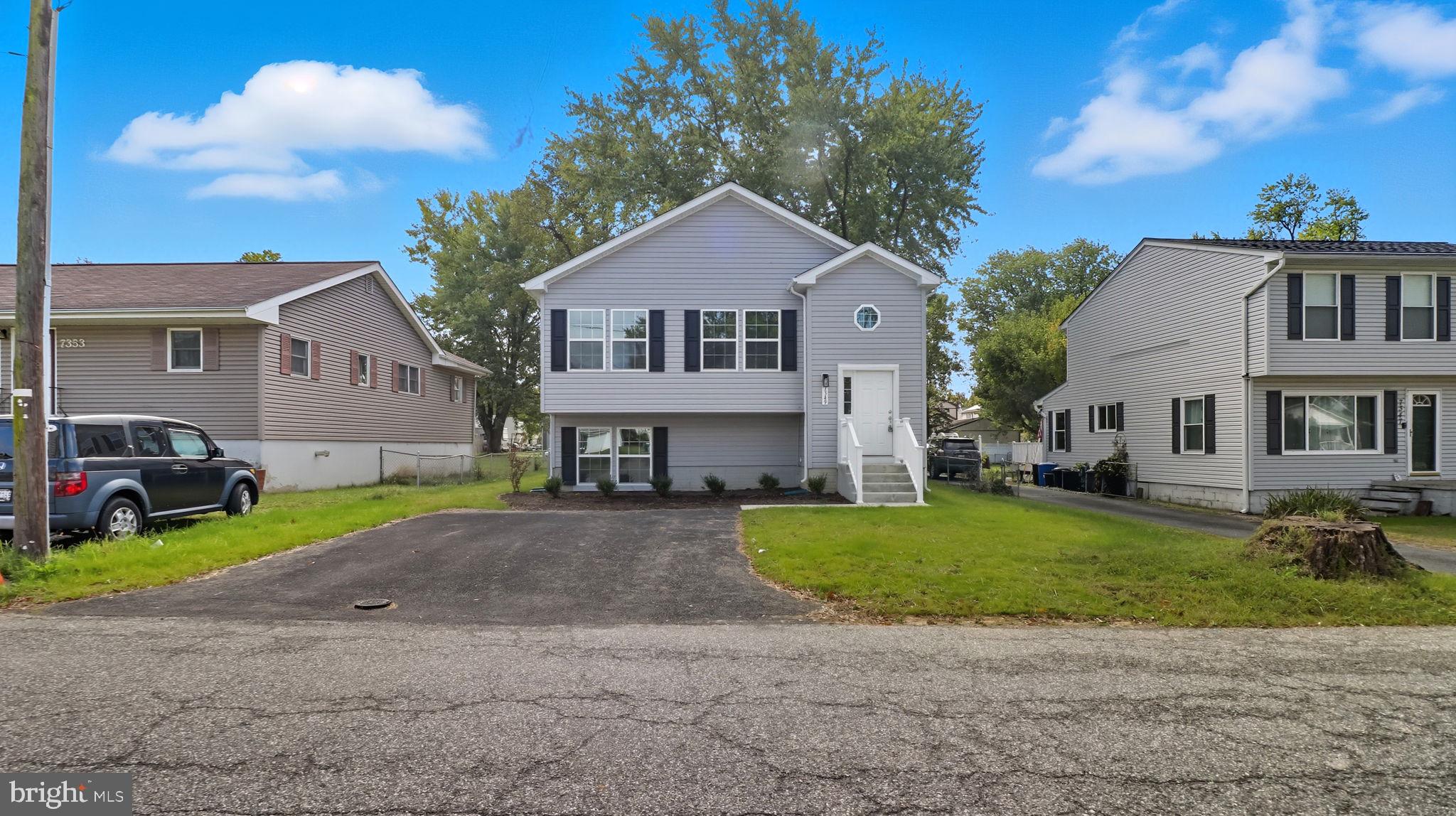 7349 Hughes Avenue Sparrows Point, MD 21219 - Photo 38 of 38 a front view of a house with garden