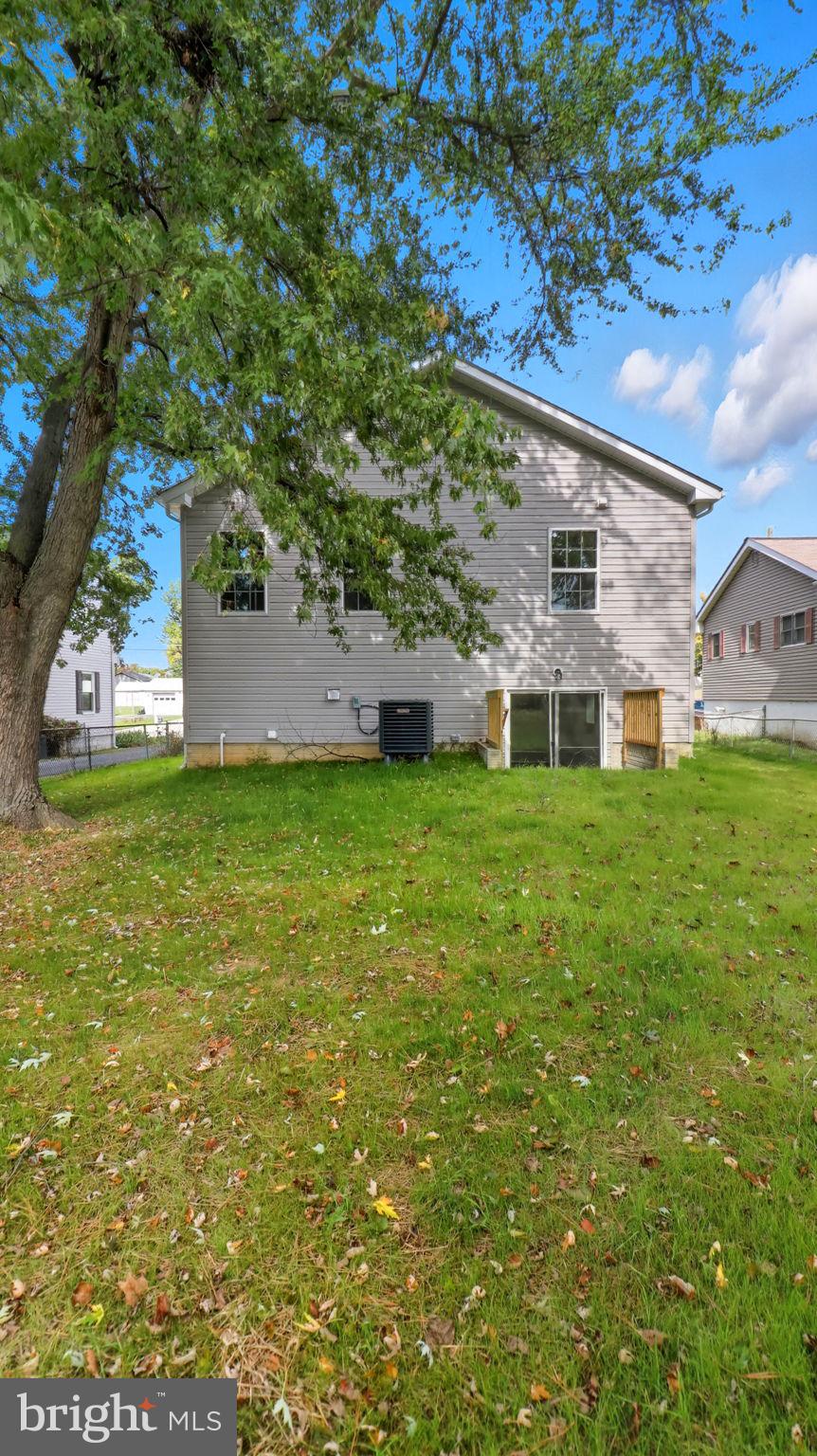 7349 Hughes Avenue Sparrows Point, MD 21219 - Photo 4 of 38 a view of a house with a big yard