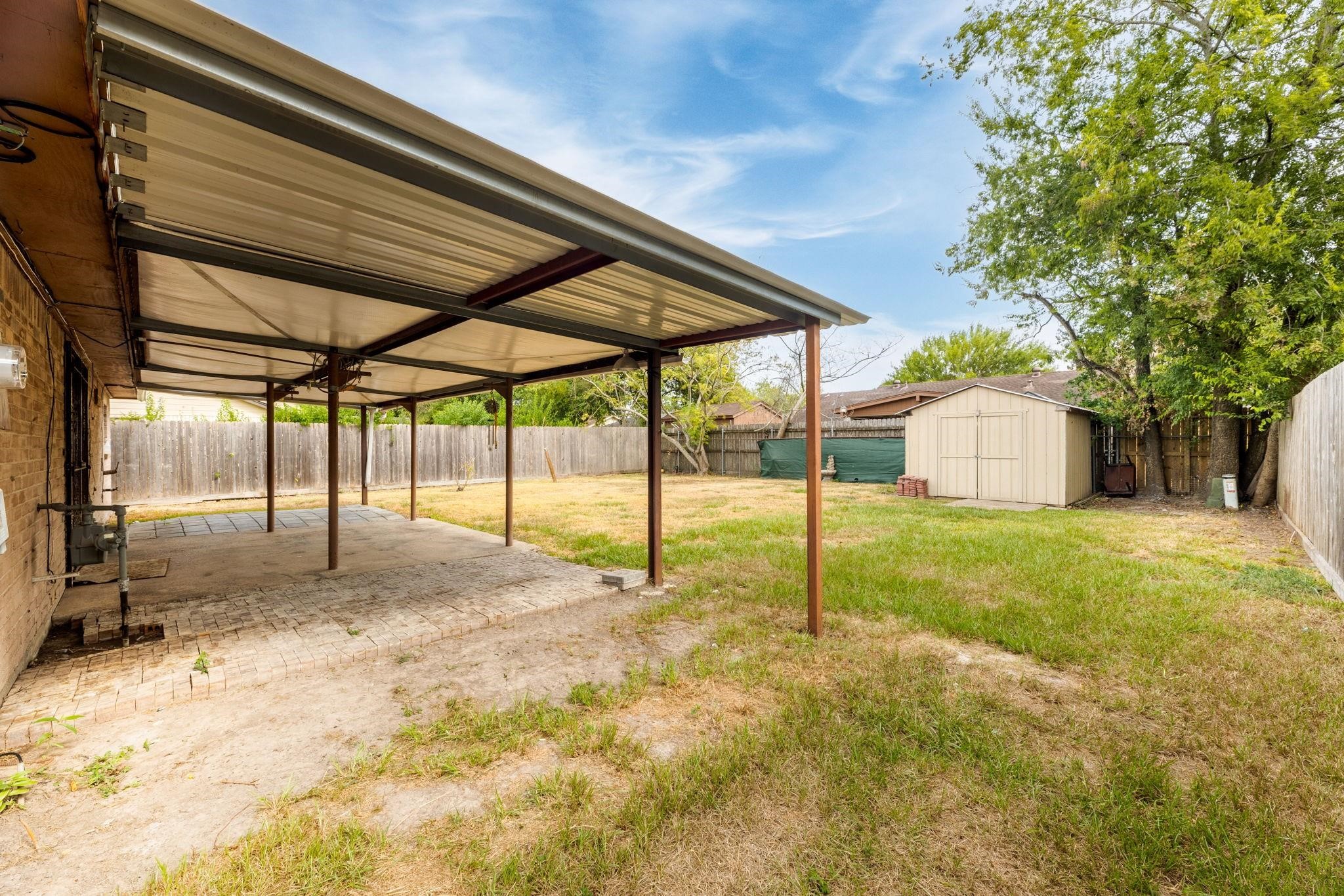 3606 Balmorhea Avenue Houston, TX 77039 - Photo 20 of 21 a view of a house with a backyard and a tree